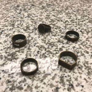 This is an assortment of men's gold brushed rings